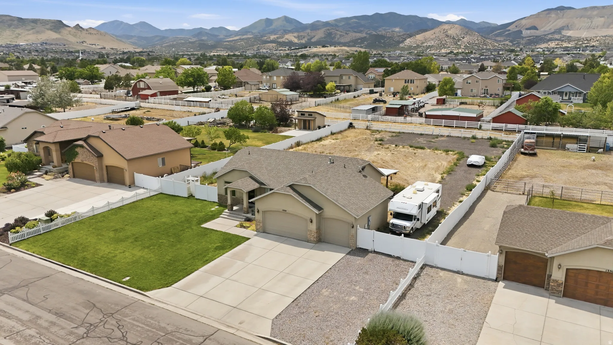 Single-story residence featuring a neutral-toned exterior, an attached two-car garage, and a concrete driveway