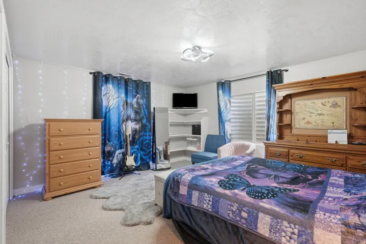 Bedroom featuring carpeted flooring and white walls