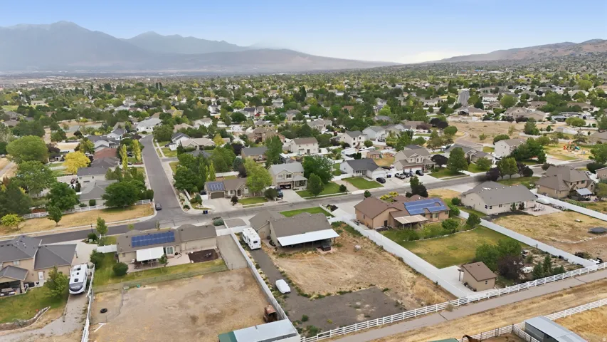 Expansive neighborhood featuring numerous residential properties and mountainous backdrops