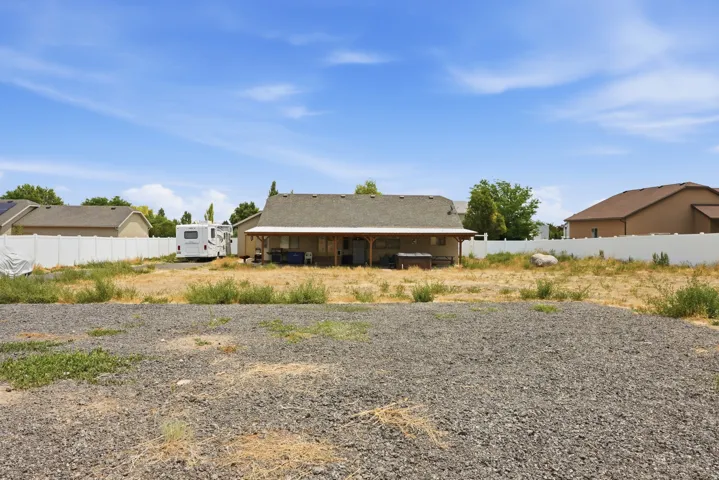 Expansive gravel and dirt lot, offering significant undeveloped space