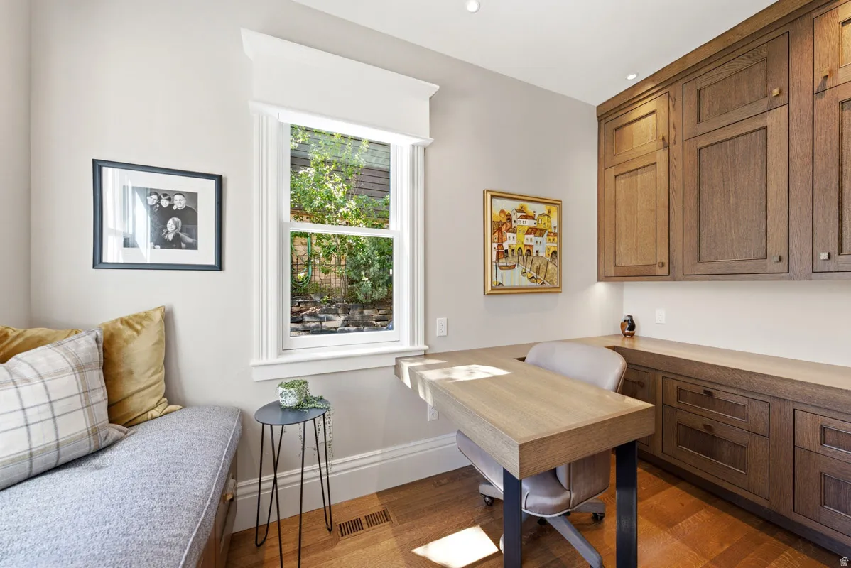 Custom built-in desk with integrated cabinetry and task lighting