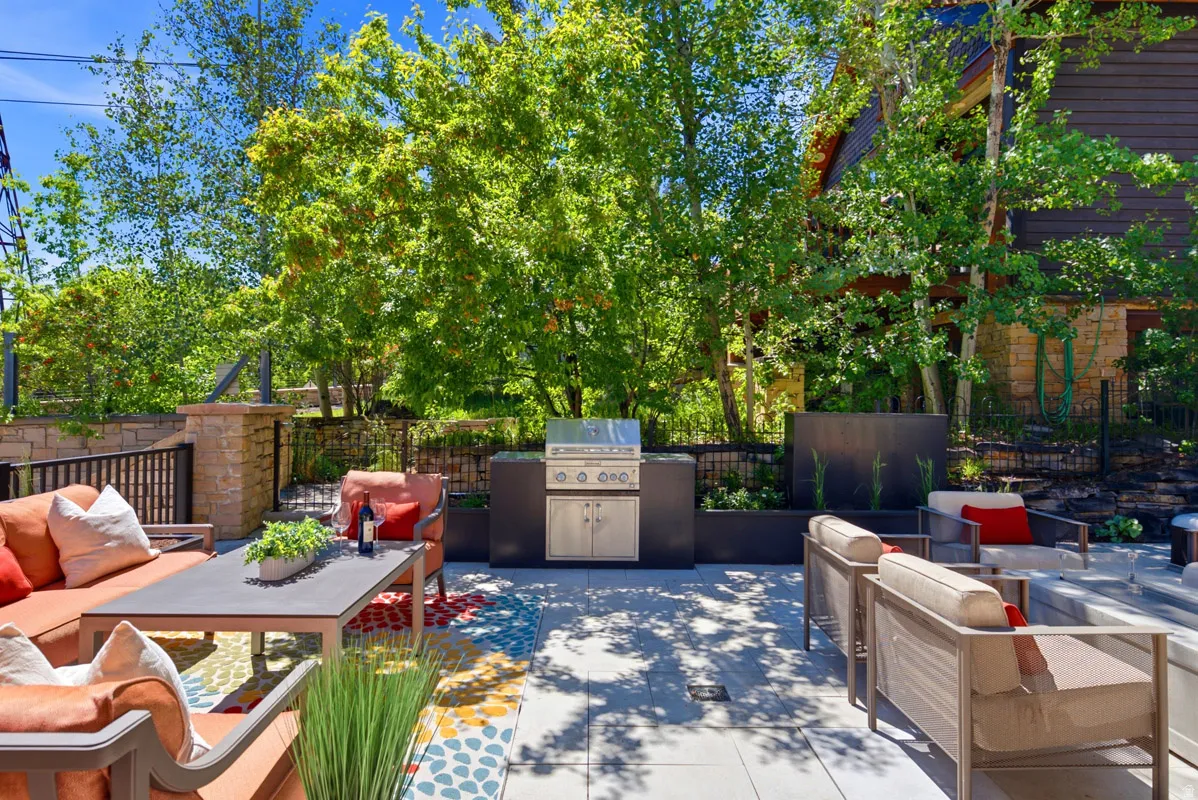 Expansive outdoor patio featuring light-toned paver flooring