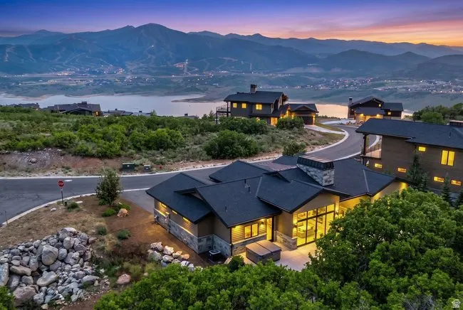 Modern architectural residence with a stone and siding exterior