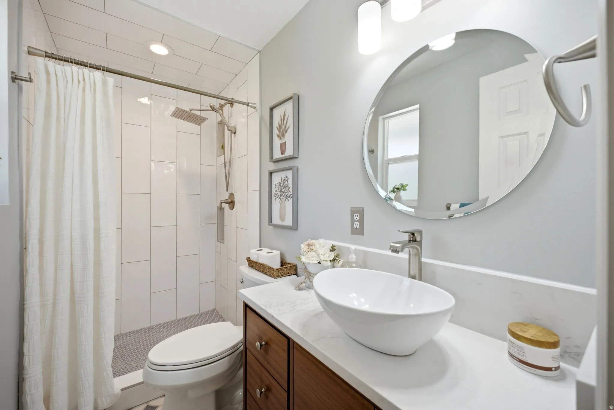 Master Modern bathroom featuring a walk-in shower with vertical subway tile, dual shower heads, and a tiled floor