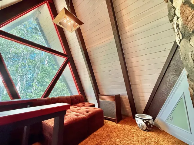 Architectural window wall with red framing and geometric panes