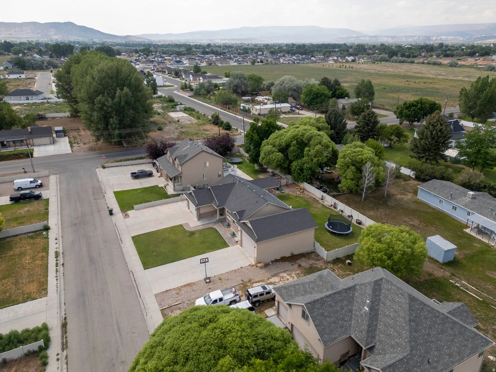 Aerial perspective showcasing a residential street with multiple properties