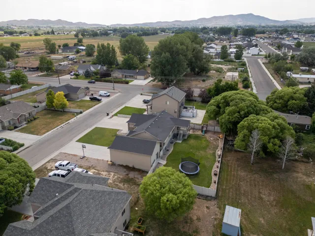 Aerial perspective showcasing a residential area with paved streets and manicured lawns