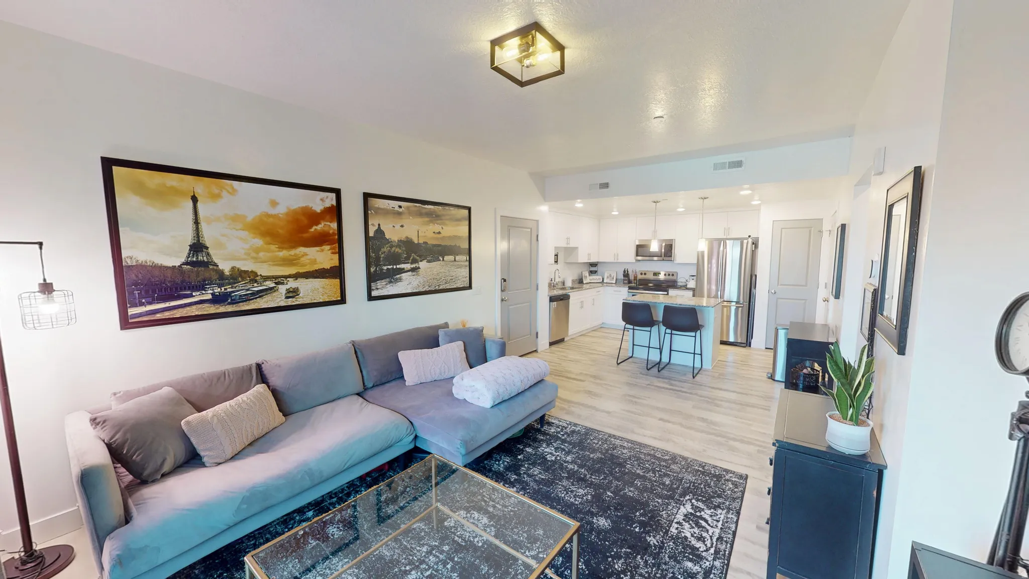 Open-concept living space featuring wood-finish flooring