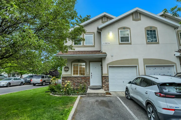 Stucco exterior with stone accent siding