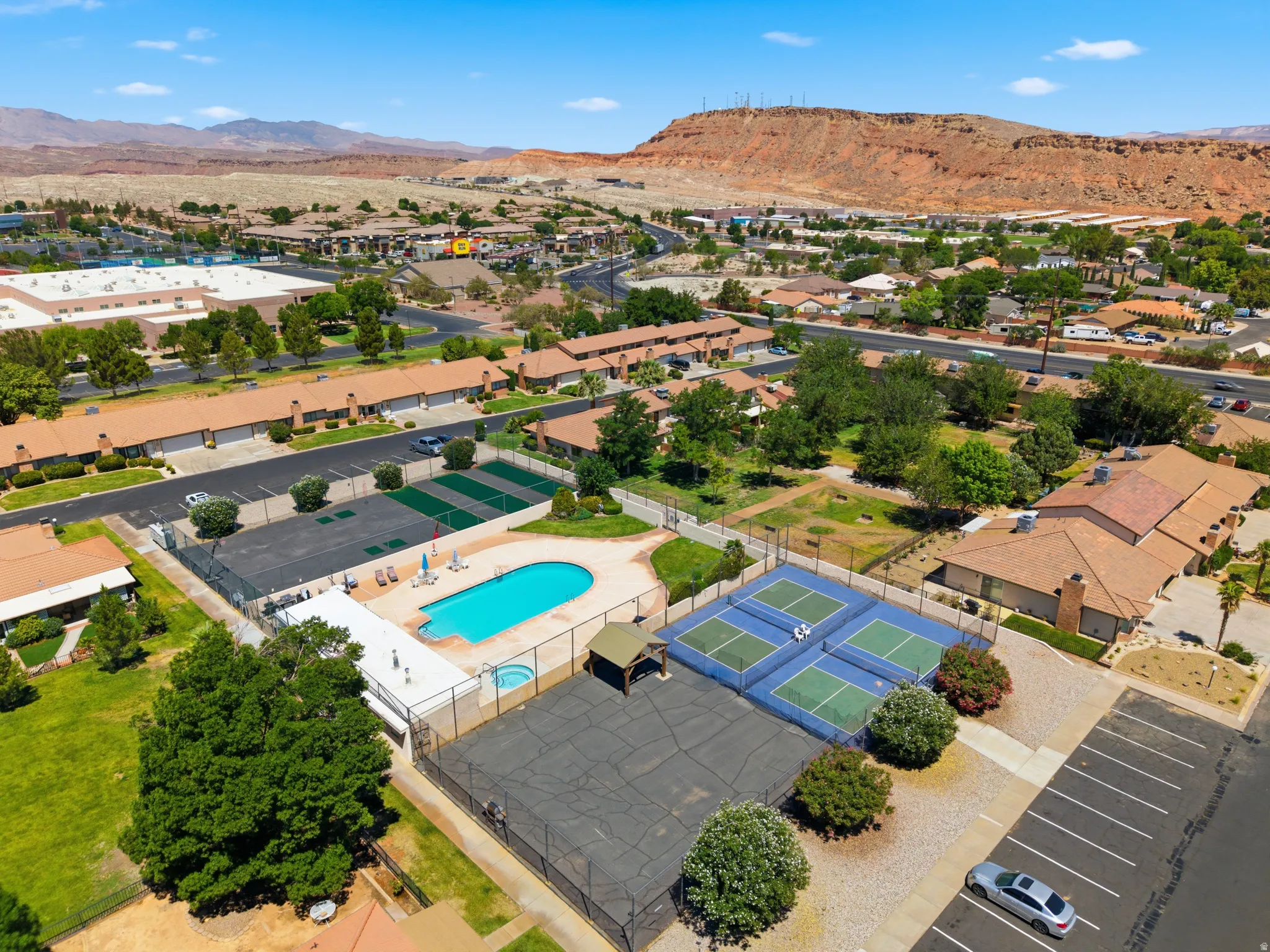 Community amenities featuring a swimming pool, spa, and two tennis courts