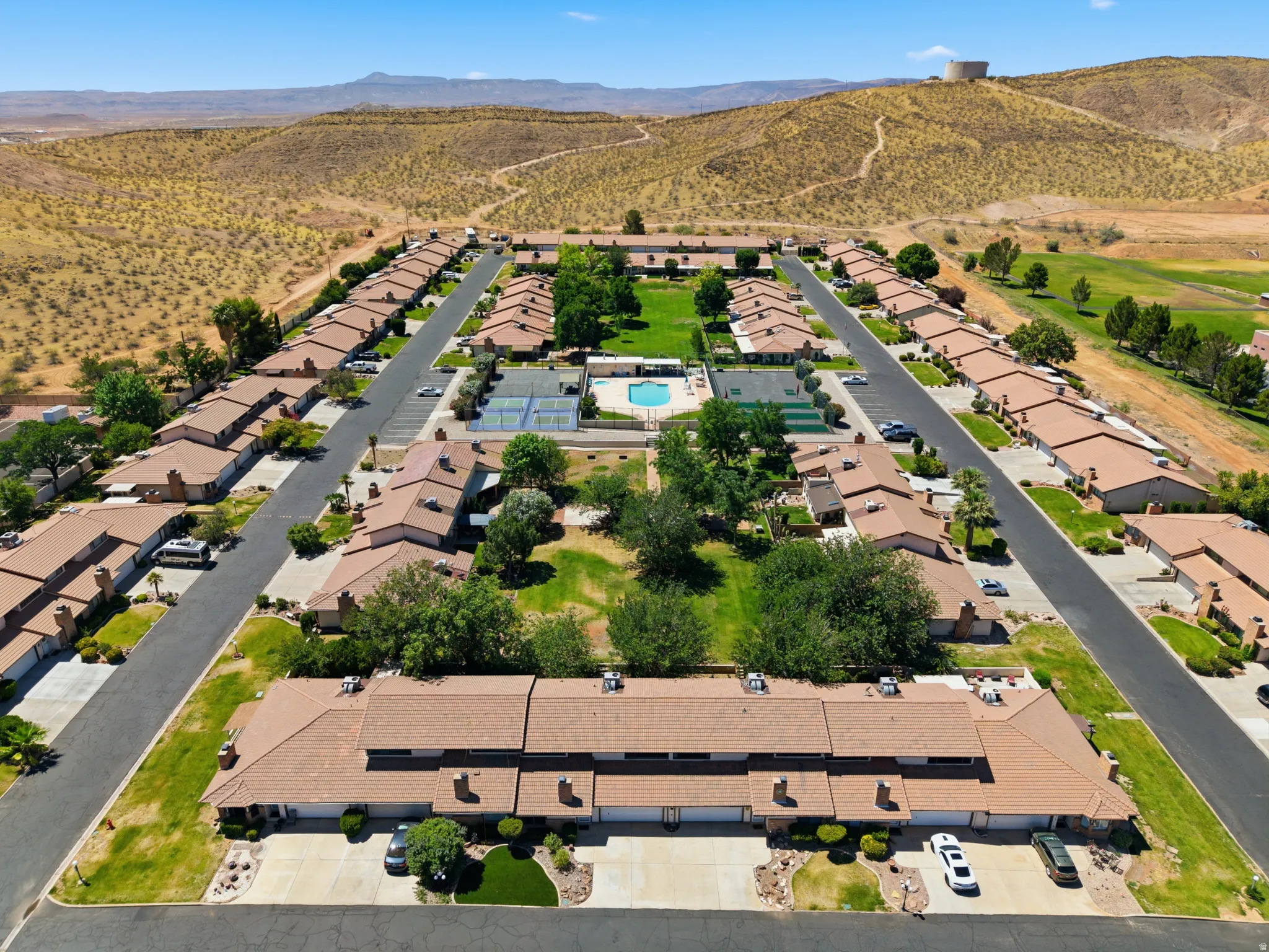 Aerial perspective showcasing the community layout with a central green space