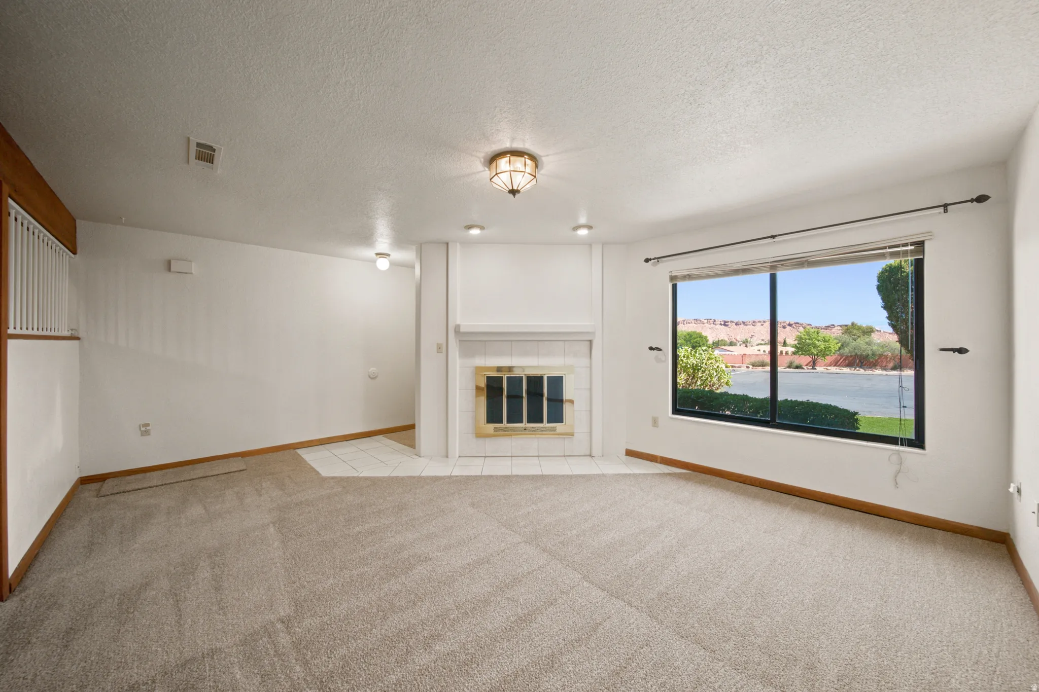 Expansive window offering a broad landscape