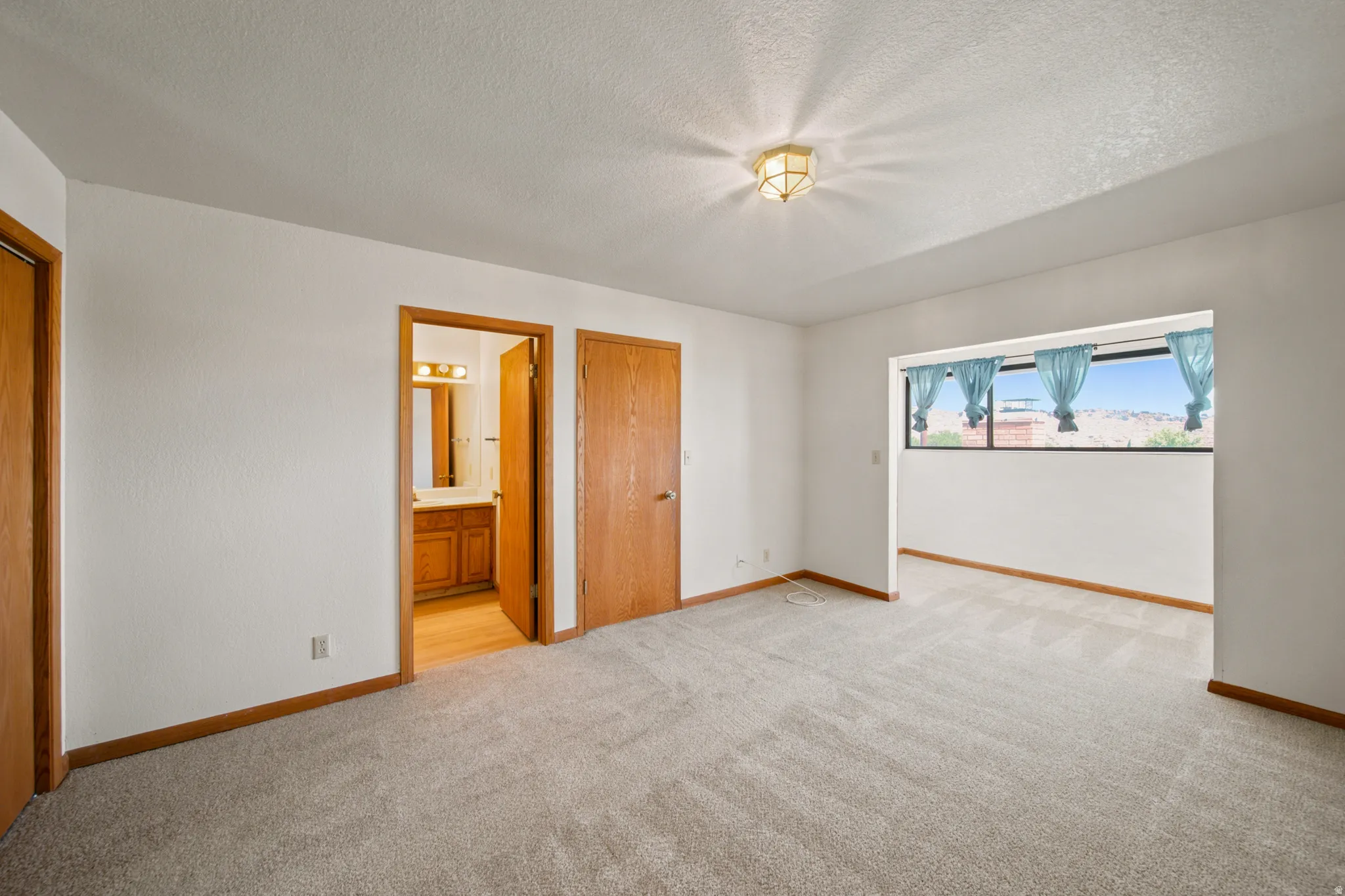 Neutral-toned carpeting throughout