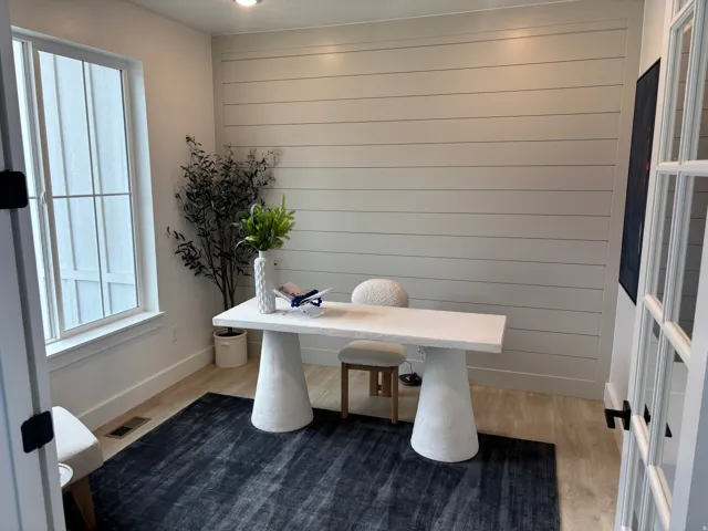 Interior room featuring a prominent shiplap accent wall