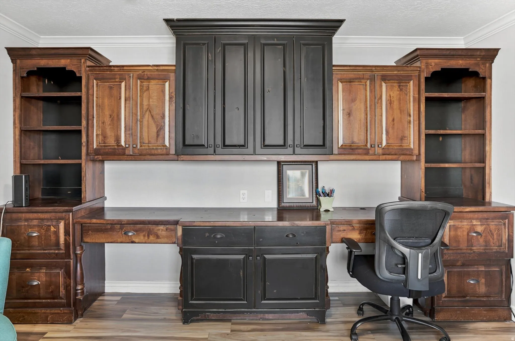 Built-in custom cabinetry with natural wood-finish and distressed black finishes