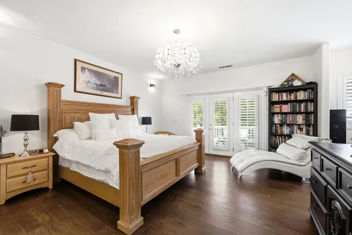 Hardwood-style flooring throughout this room, featuring a built-in bookshelf