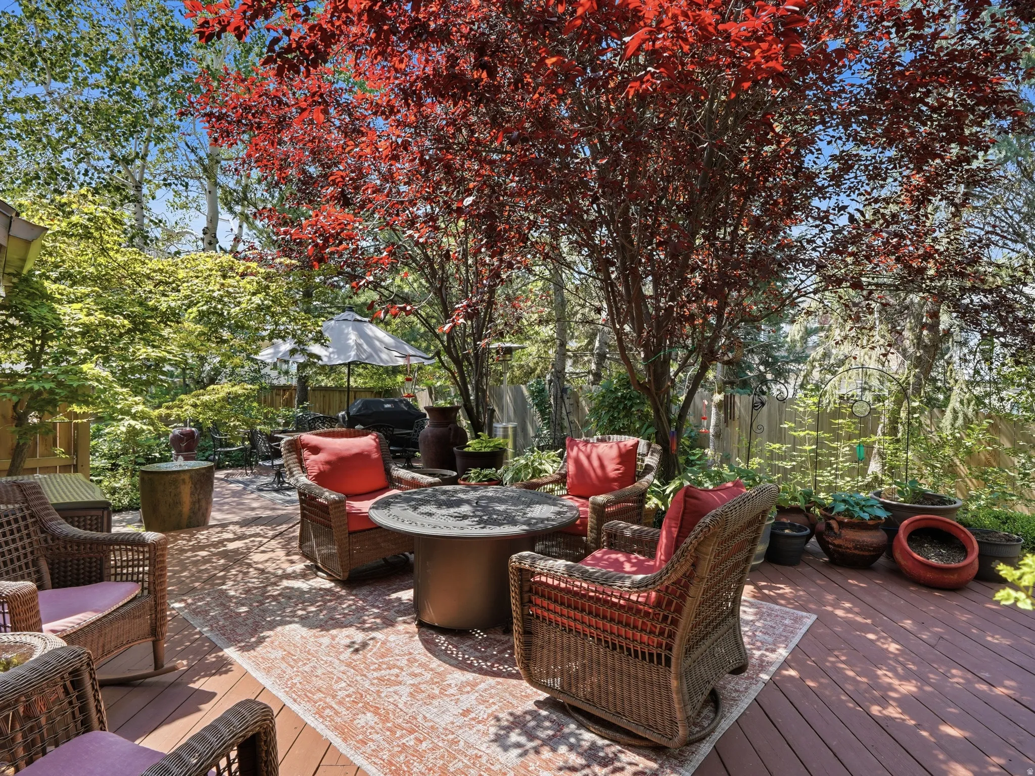 Another view of seating area in lovely backyard