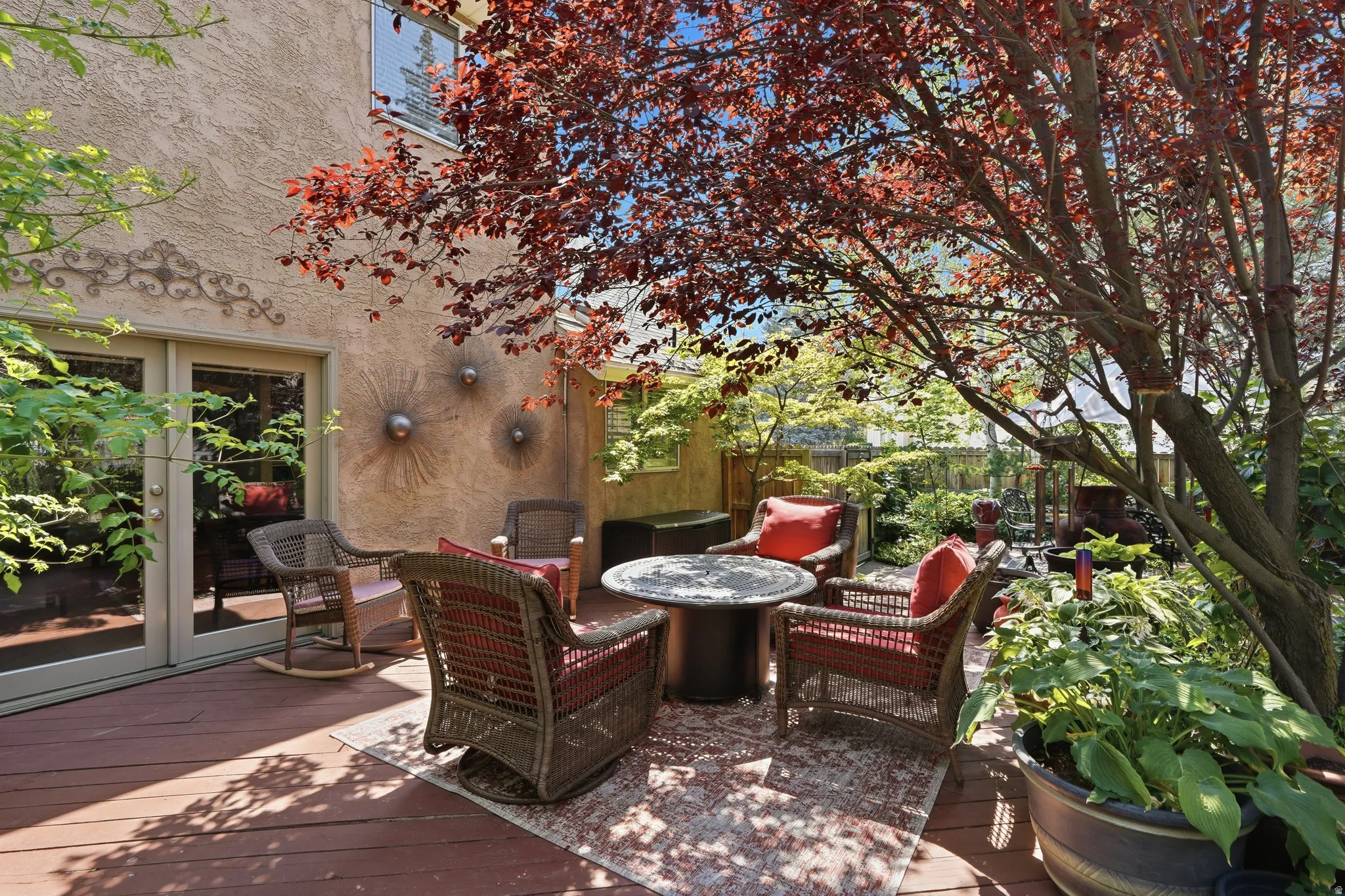 Another view of seating area in lovely backyard