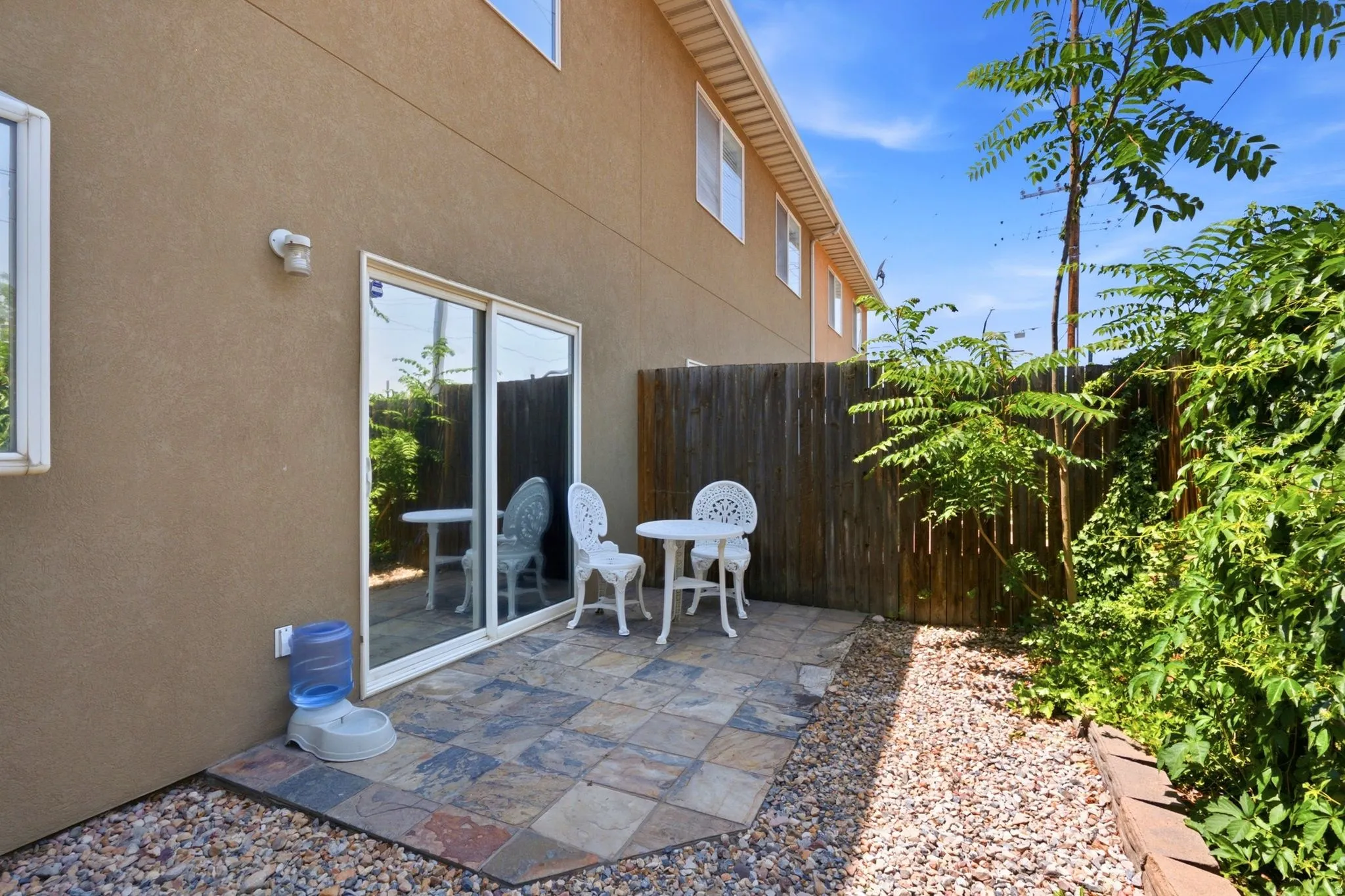 Private patio featuring multi-toned square pavers