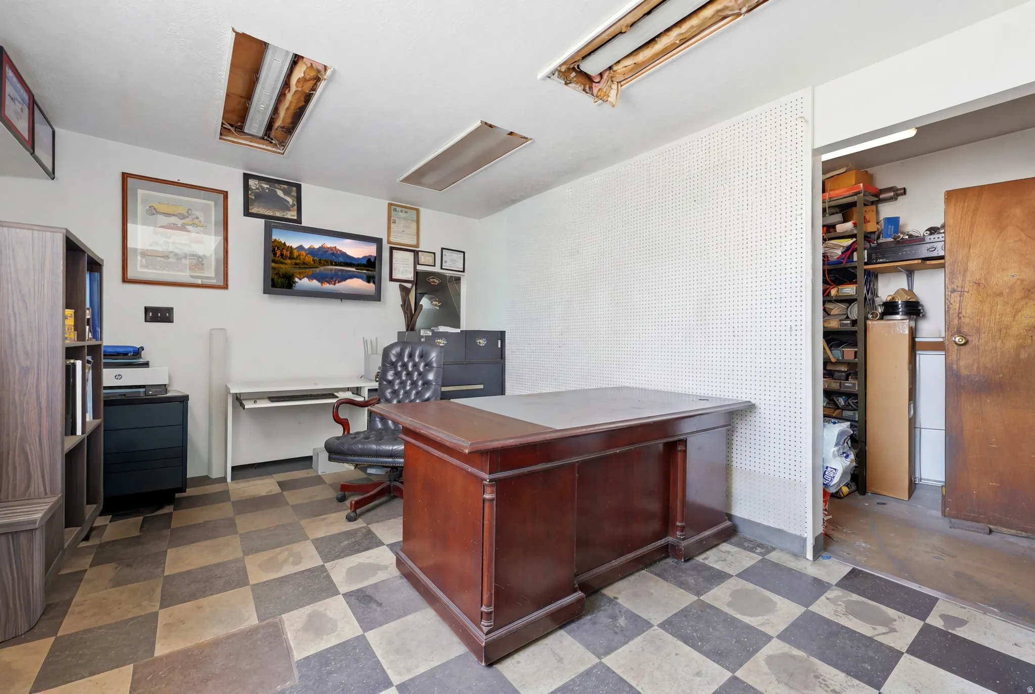 Room featuring checkered flooring and white walls