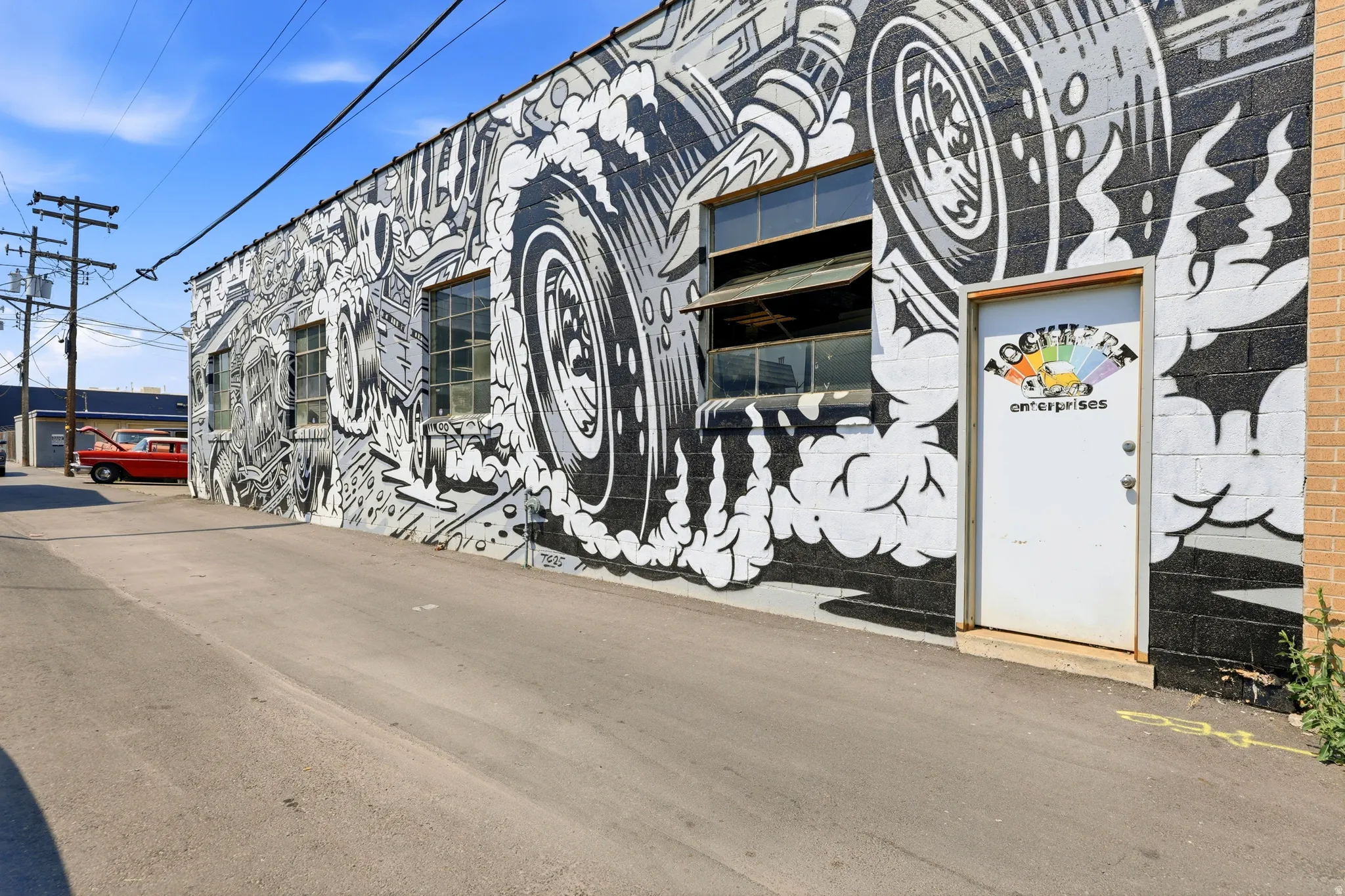 Industrial building exterior featuring a black and white mural