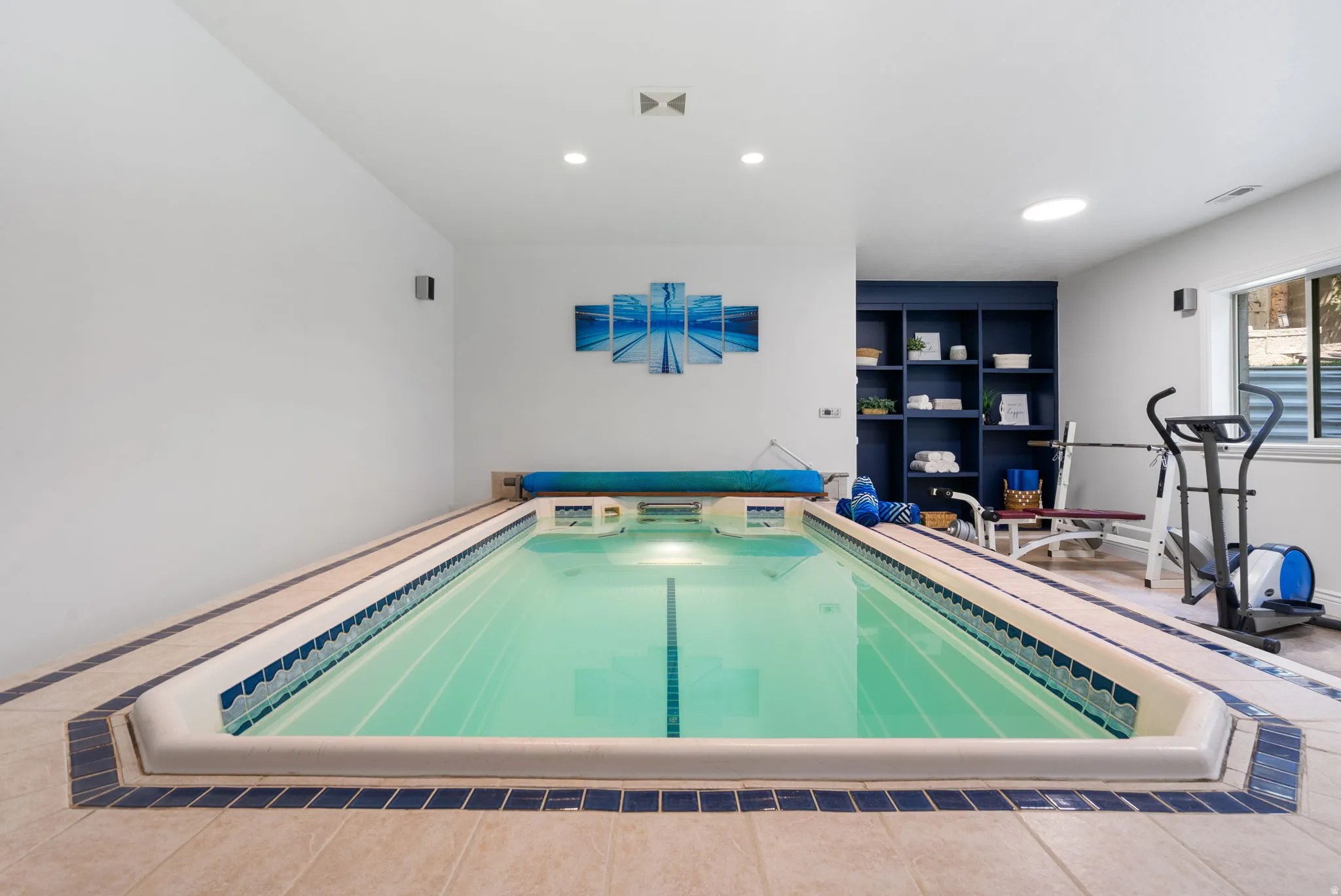Train like a champion in your private, dedicated wellness studio. The heated indoor swim spa offers year-round training, hydrotherapy, and relaxation.