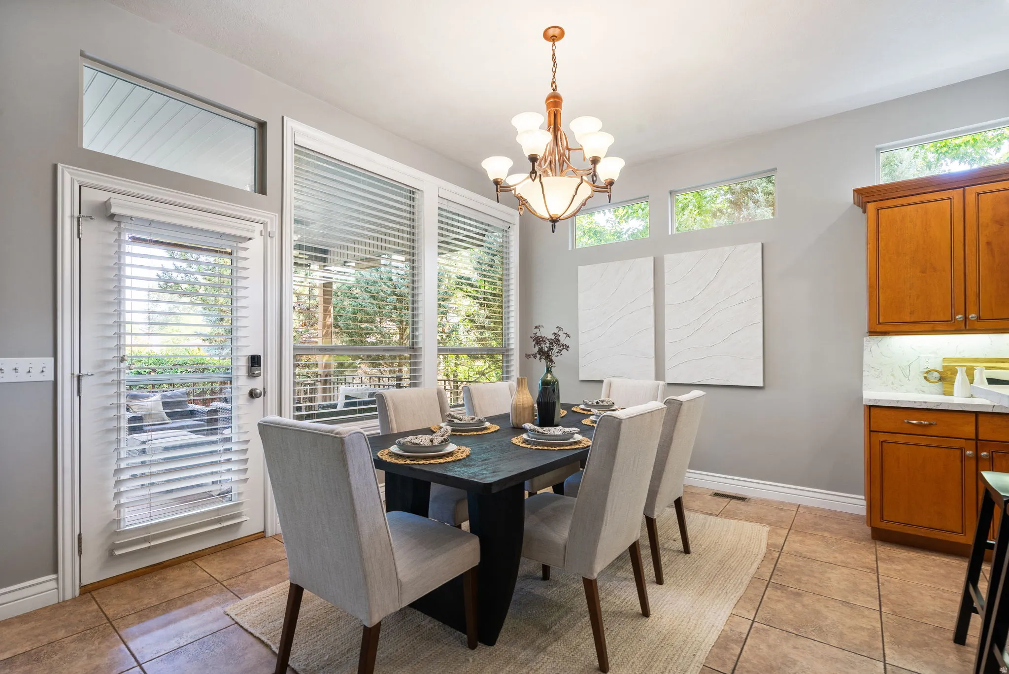 Generous sized dining area with beautiful windows for abundant light and access to deck.