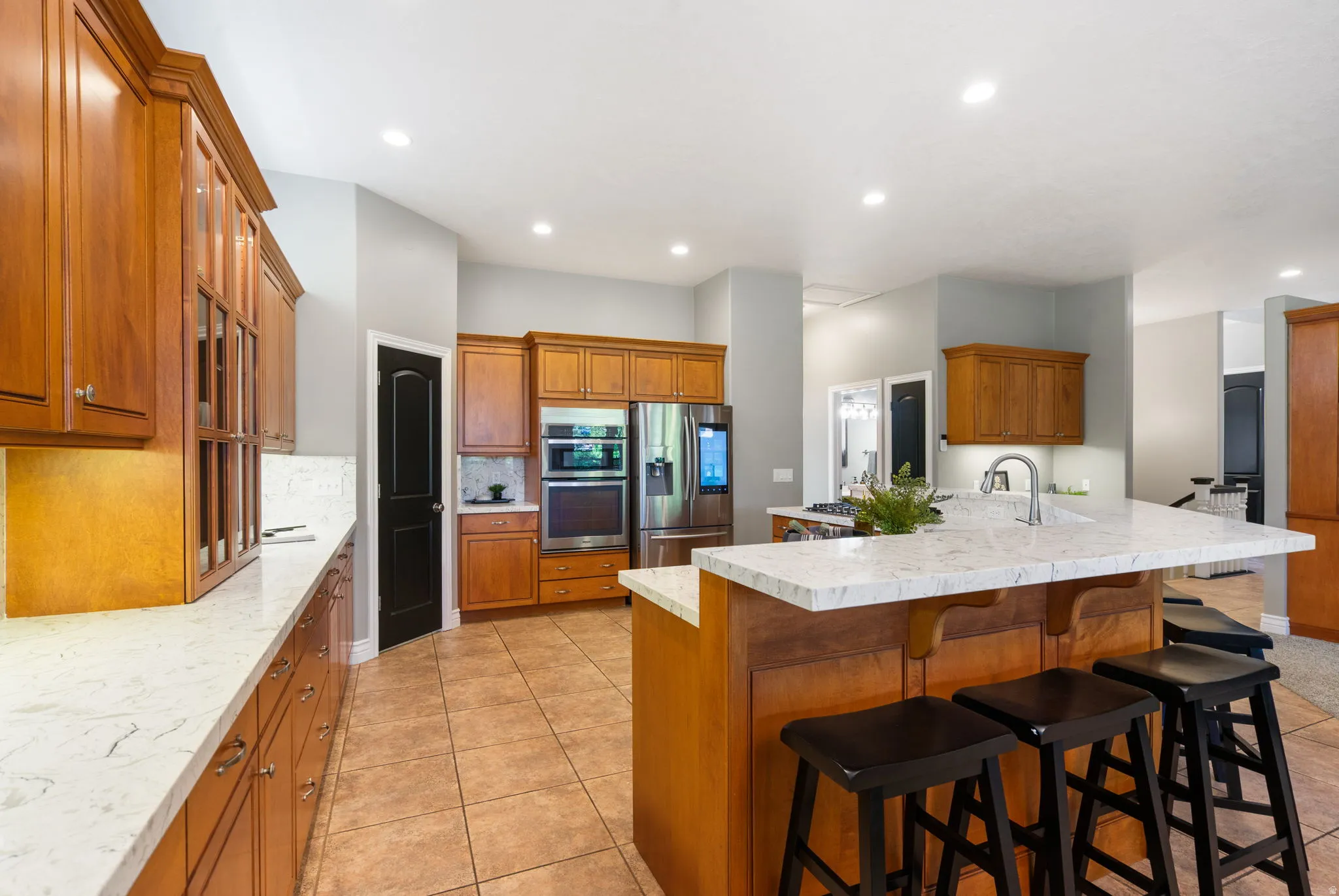 Includes all kitchen appliances; smart refrigerator, microwave/ oven, built-in wall oven and gas range cooktop, large corner pantry.