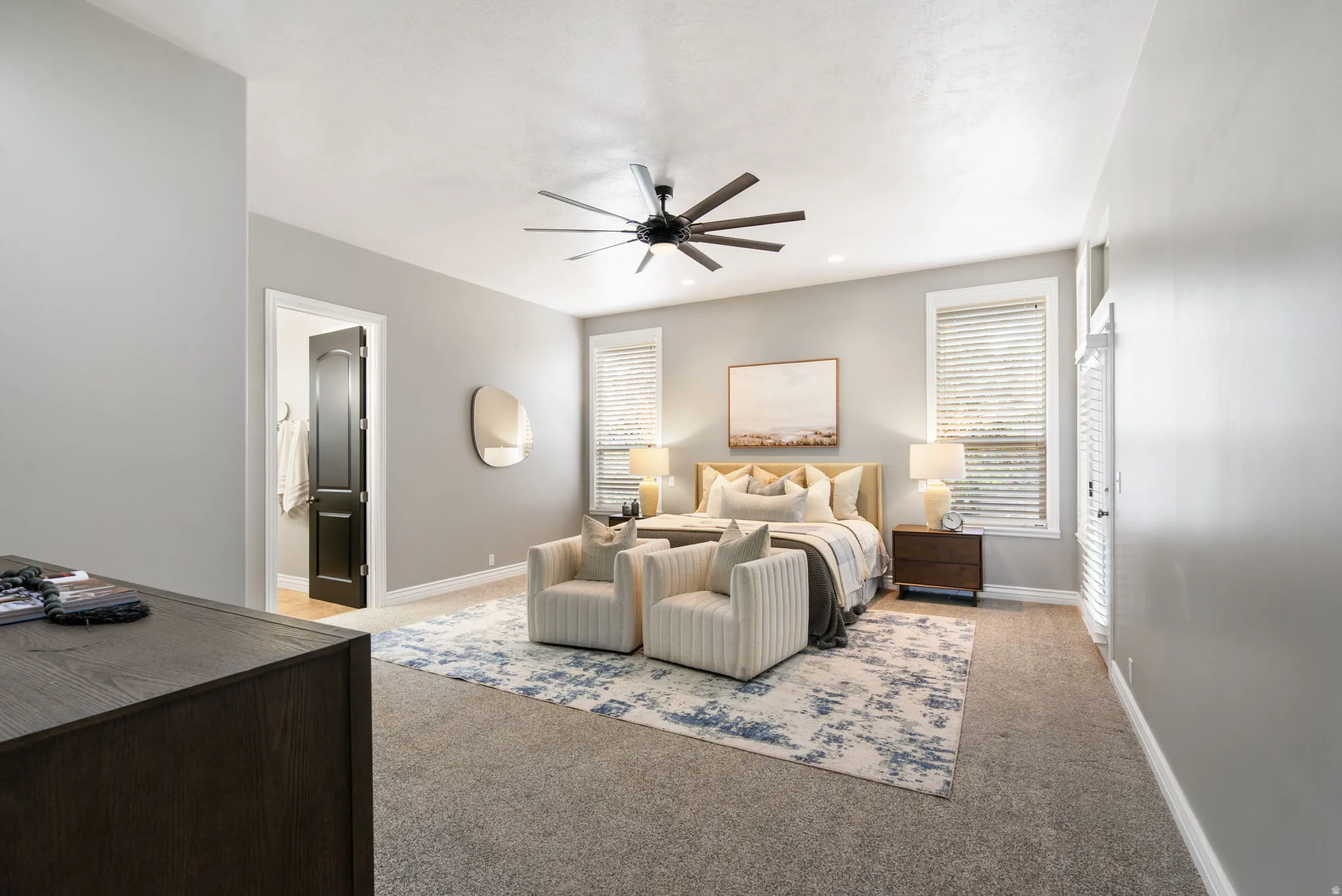 Main level primary suite with ensuite bath and walk-in closet.