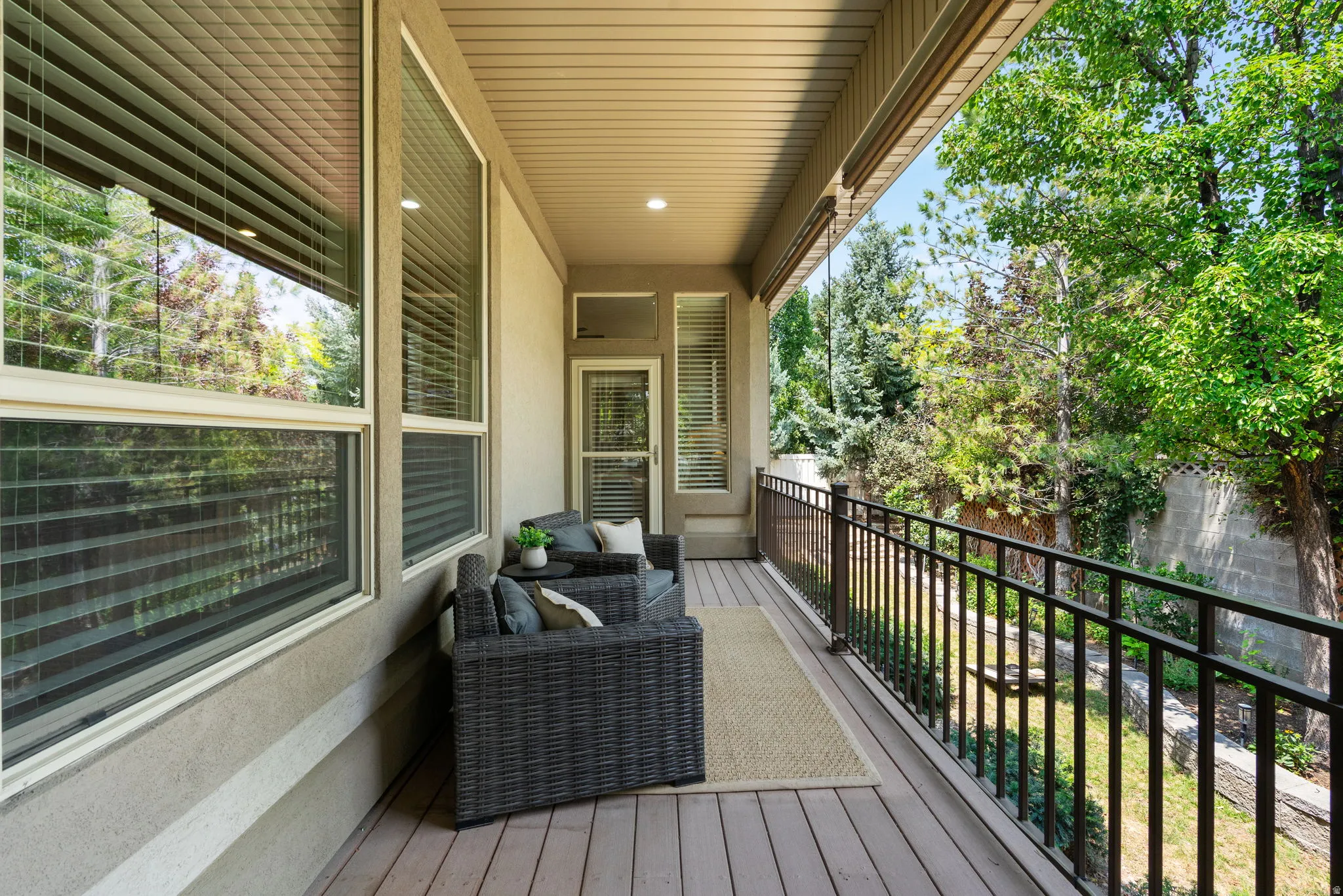 Deck continues across back of home to provide a quiet, more intimate space to relax just off primary suite.