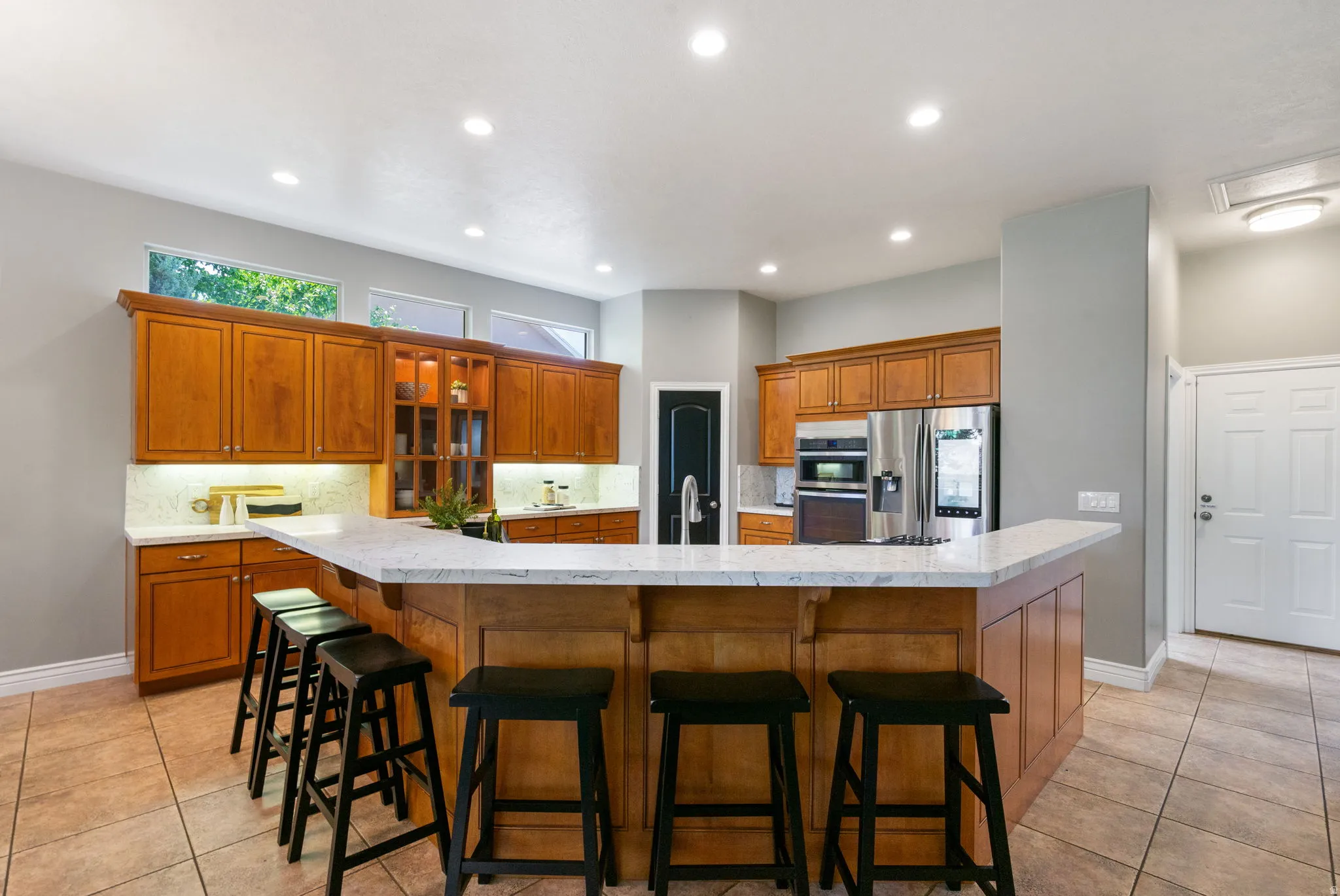 Spacious kitchen island allows extra seating.