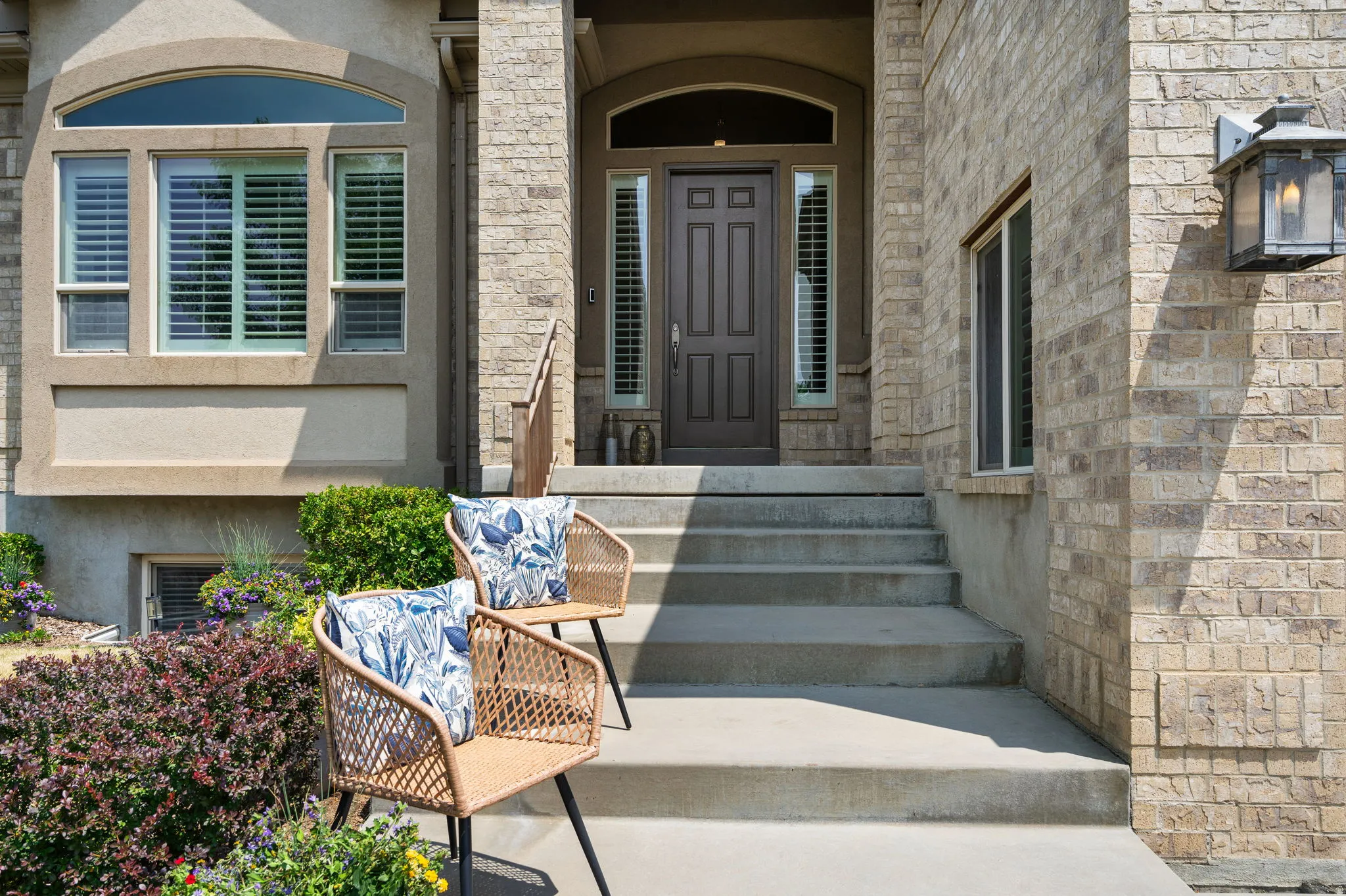 Distinguished entry with elegant architectural details makes arriving home feel special.