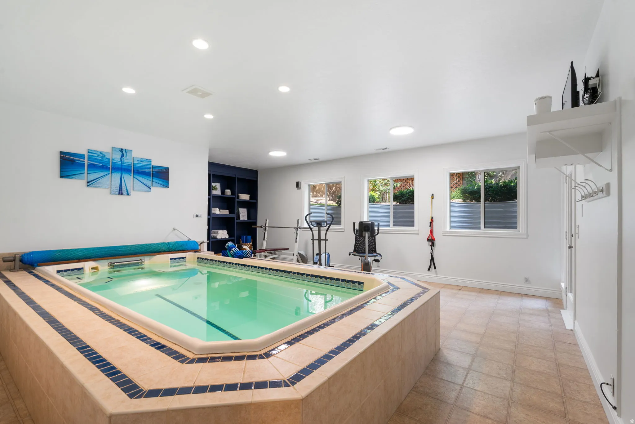 Adjoining studio space provides the perfect setting for yoga, Pilates, stretching, cardio or weight training.