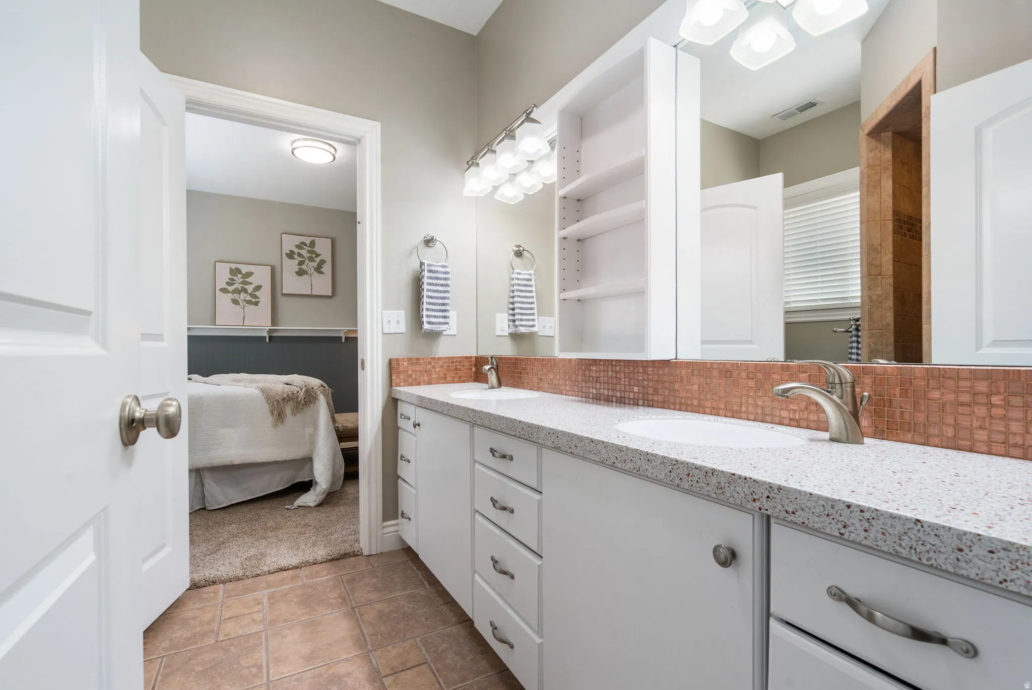 3rd bath is a cute and functional Jack 'n Jill with double vanity.