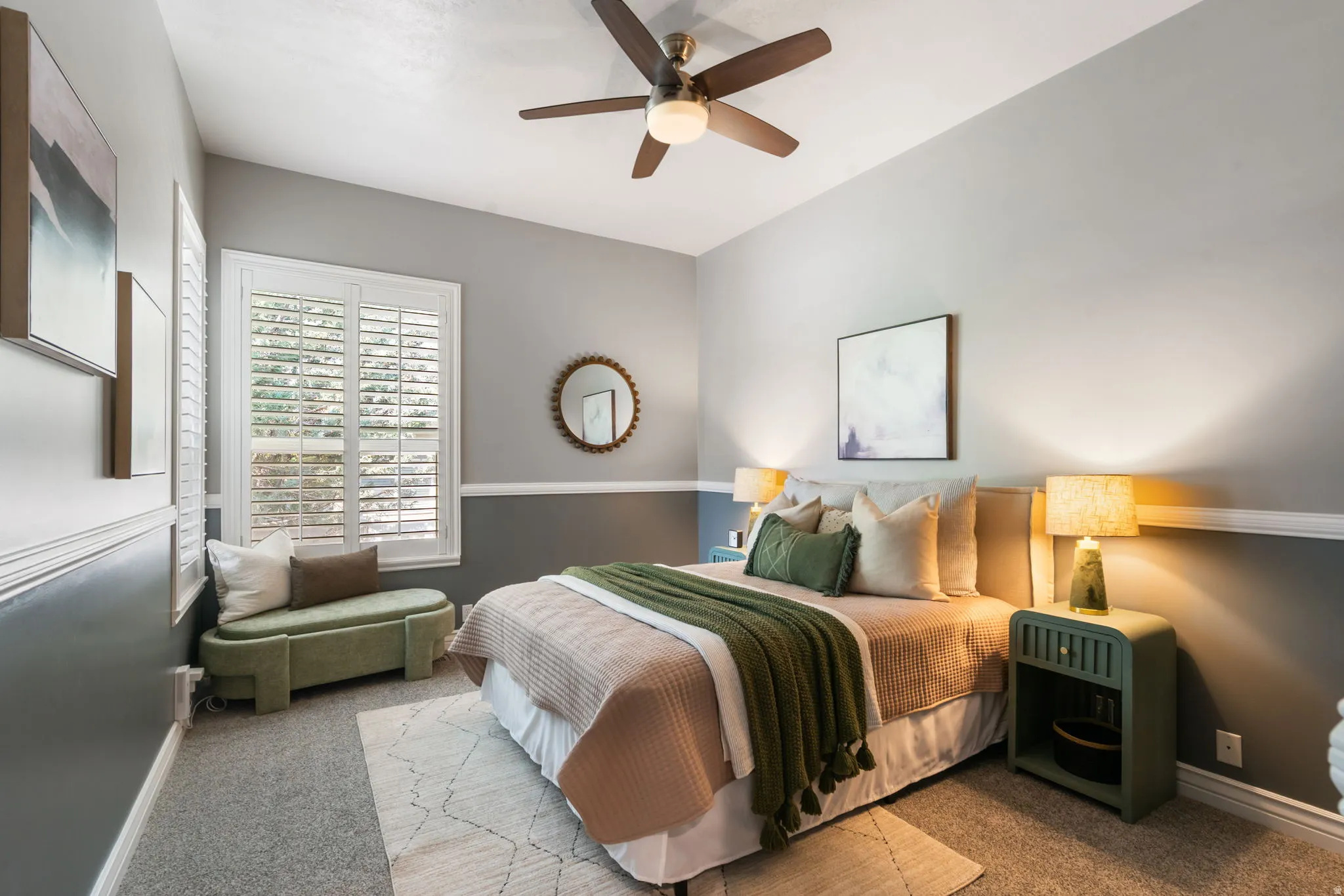 Main floor bedroom #2 with corner windows for lots of natural light and beautiful wainscoting.