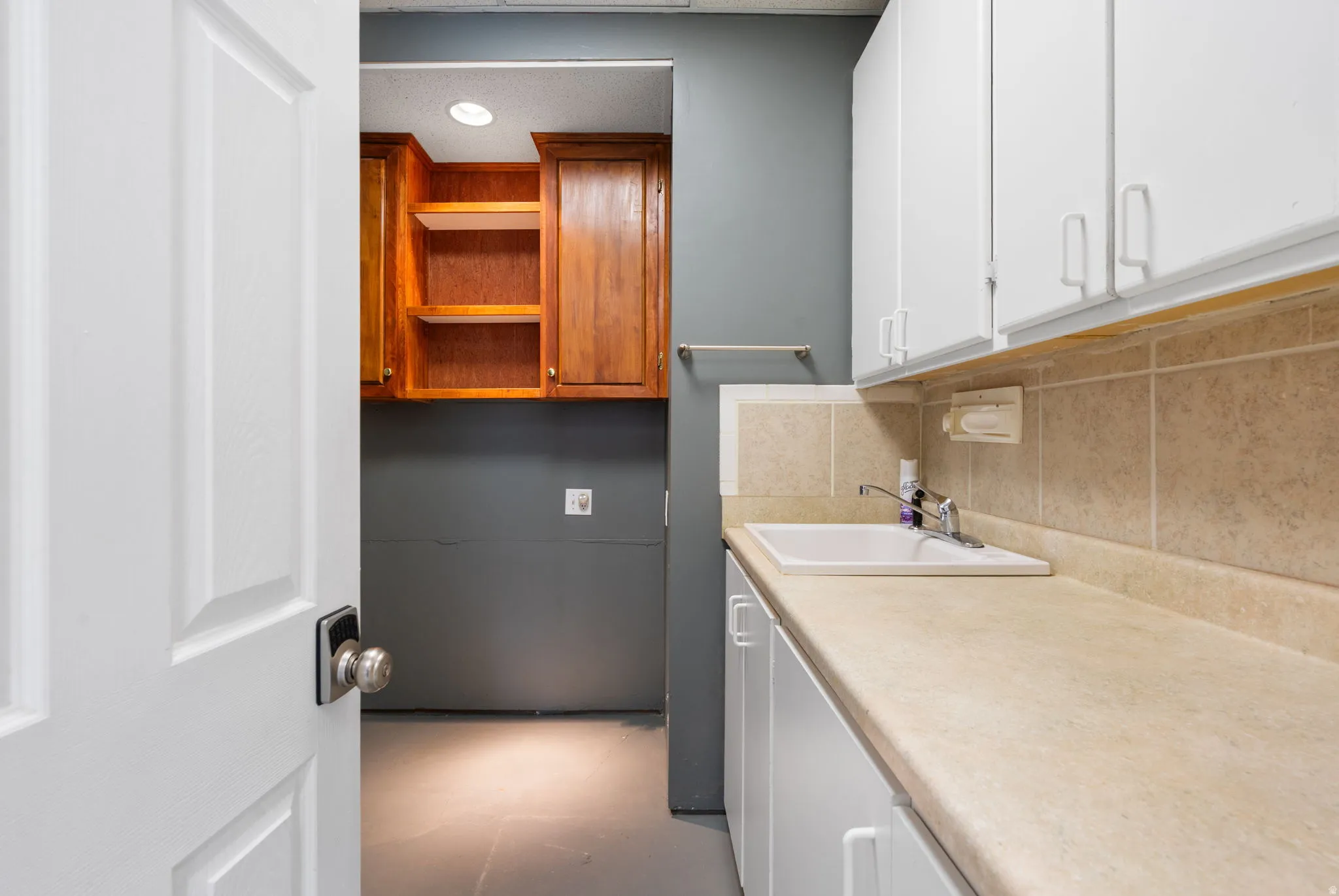 Located off current workshop is a functional utility room makes clean up easy.