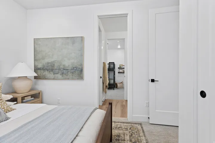 Contemporary interior with neutral wall paint and wood-finish flooring