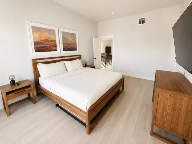 Bedroom featuring light wood-finish flooring and neutral wall tones