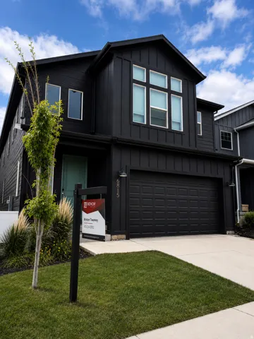 Contemporary black exterior with board and batten siding