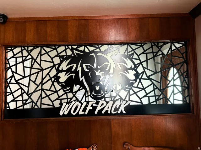 Decorative wall paneling featuring an intricate geometric pattern and a central graphic element