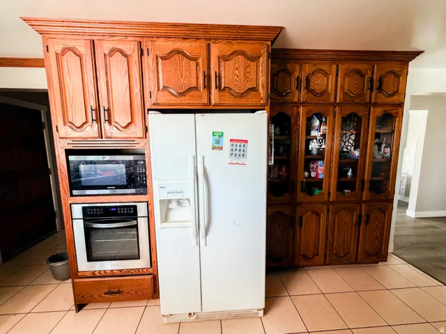 Built-in cabinetry with wood-finish doors and glass-front display cabinets