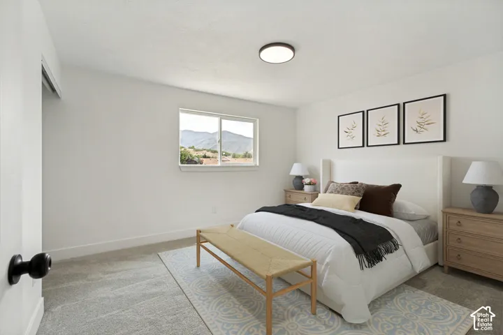 Primary Bedroom with a window, baseboard trim, and a ceiling light fixture. Jack and Jill Bathroom attached.