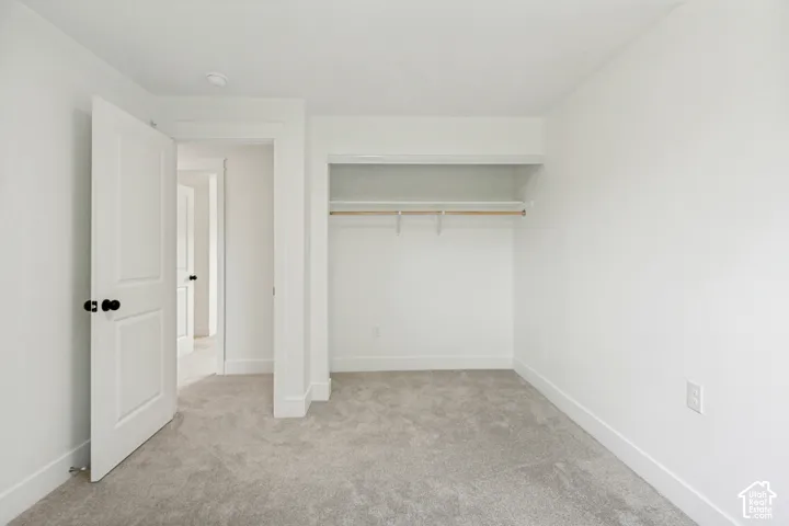 2nd Bedroom featuring light grey carpet flooring and white walls