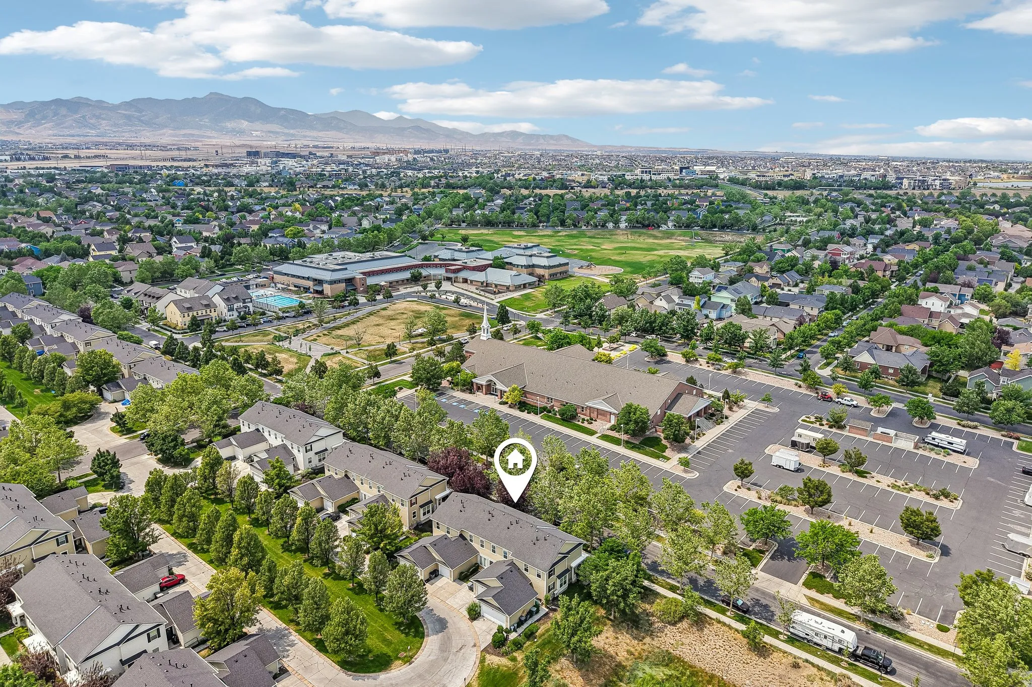 Aerial perspective showcasing a residential community with mature landscaping