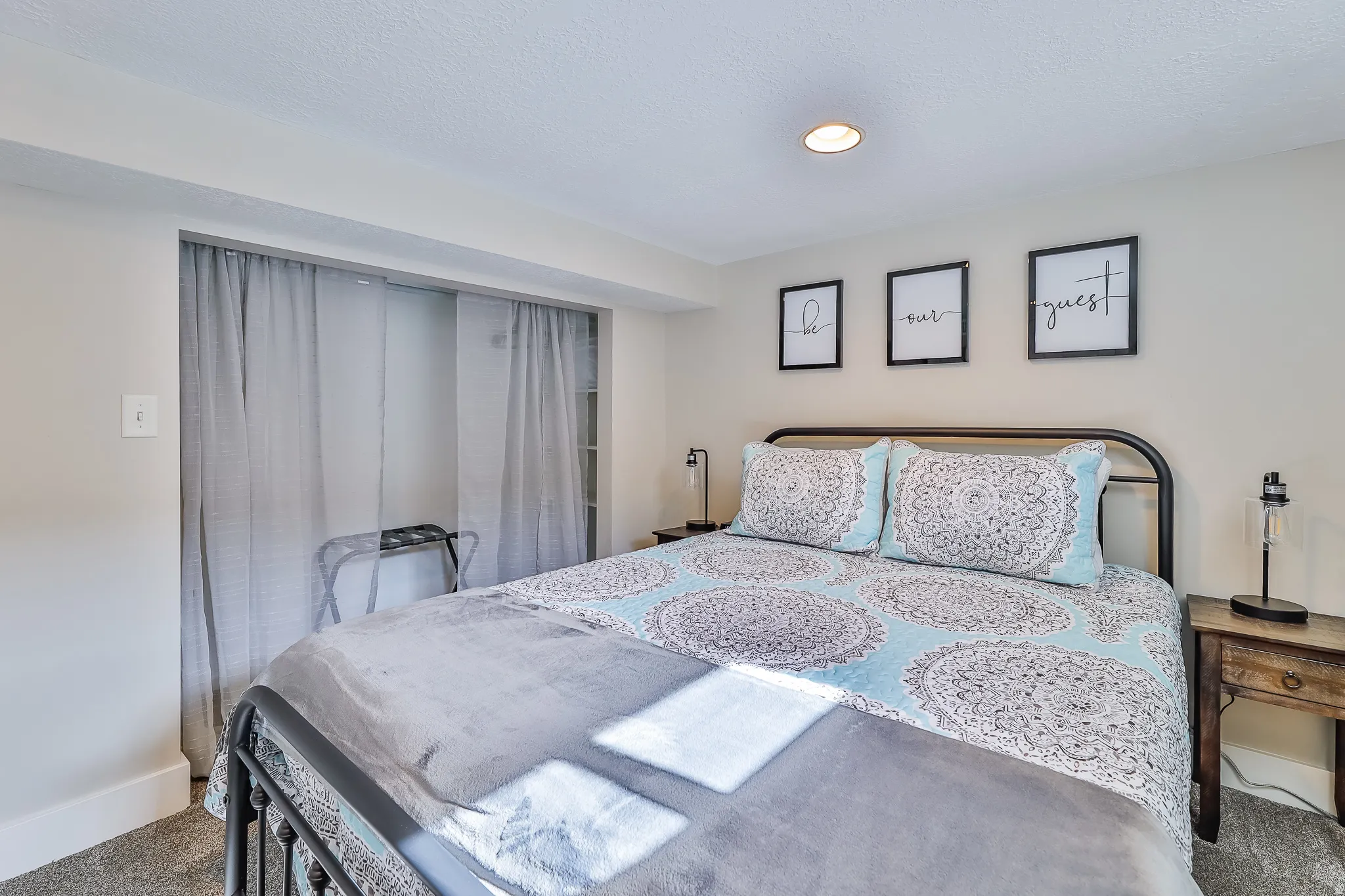 Bedroom featuring light neutral wall paint, recessed lighting, and carpet flooring