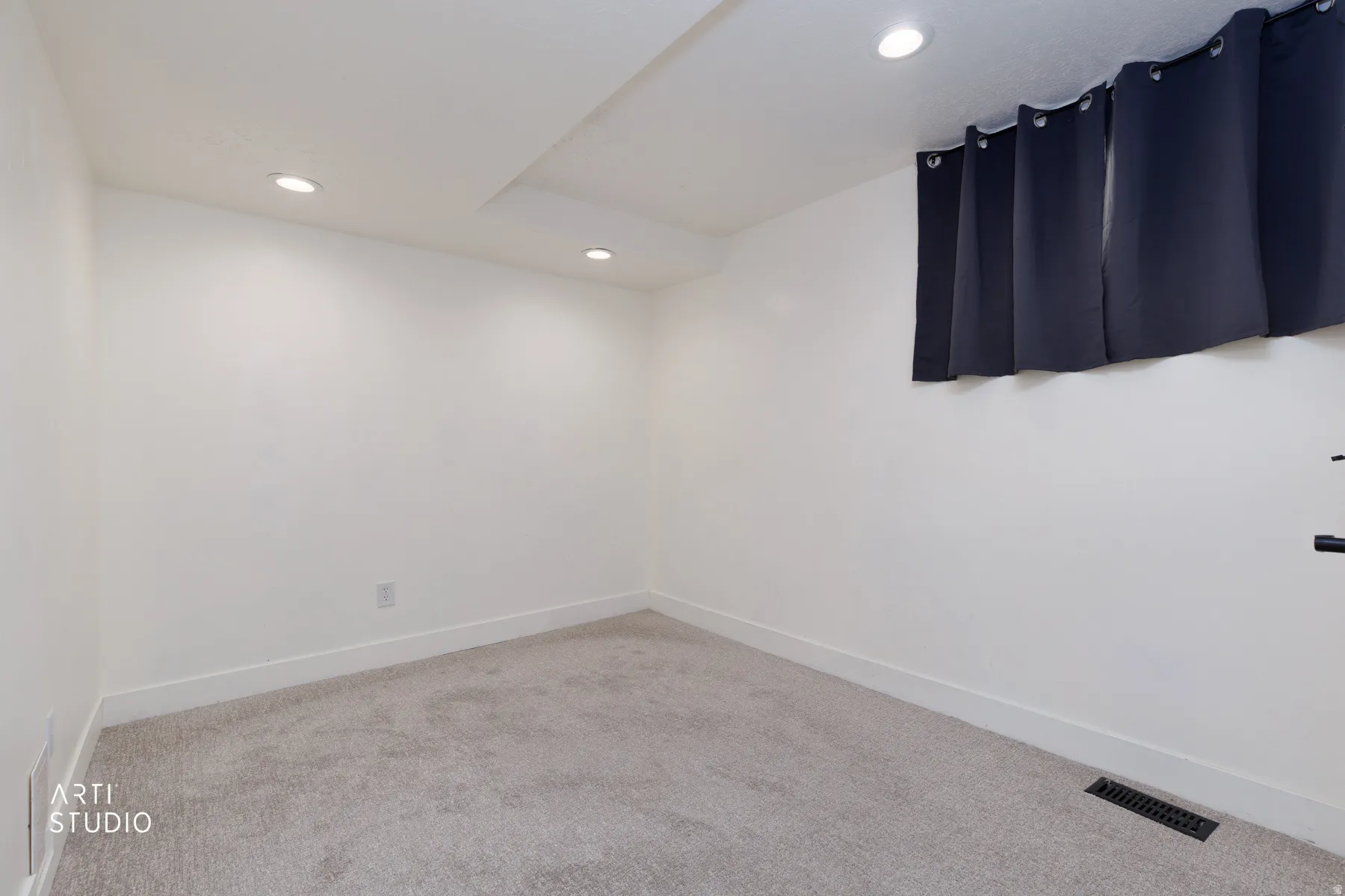 Neutral-toned carpeting paired with white walls