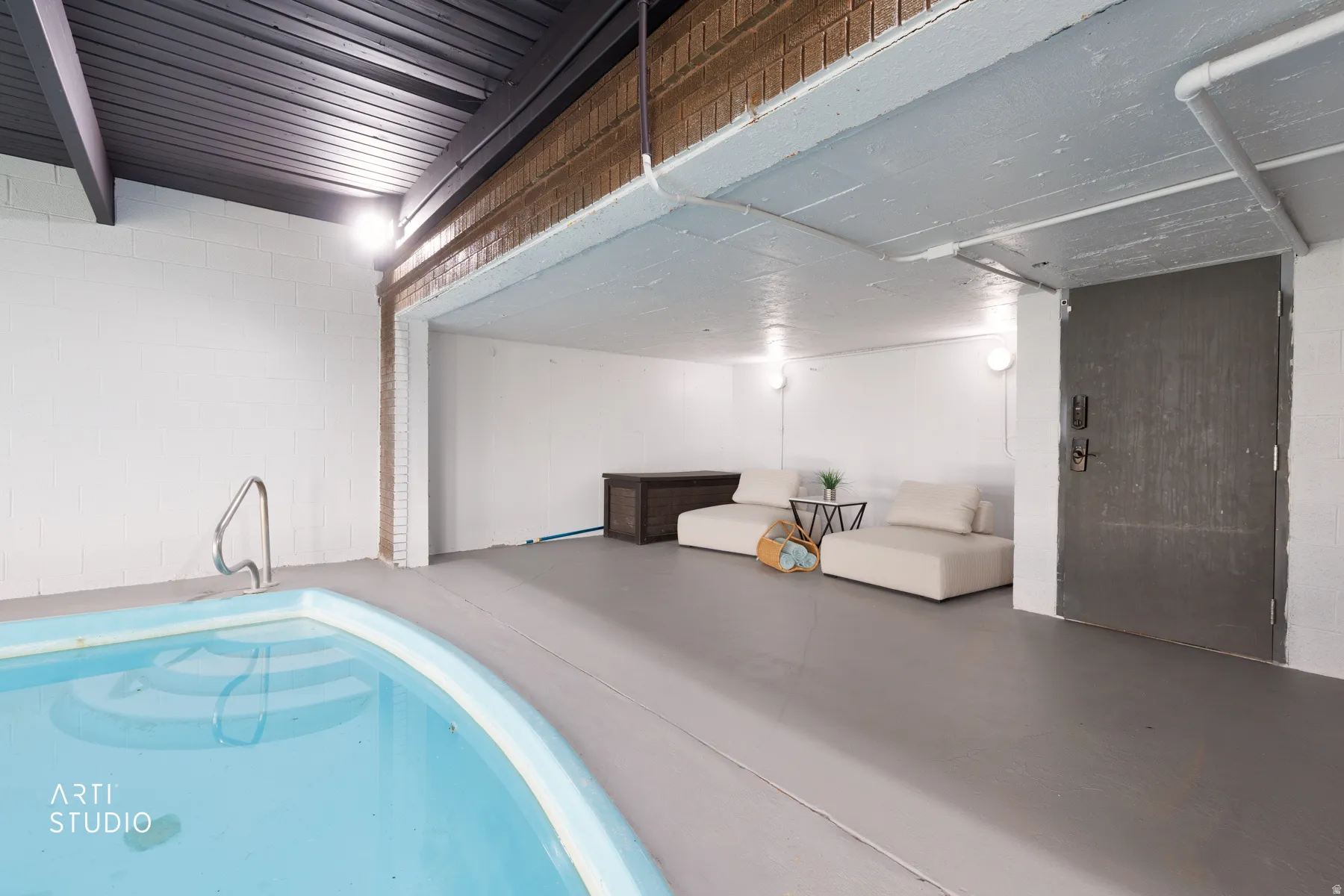 Indoor swimming pool with concrete surround