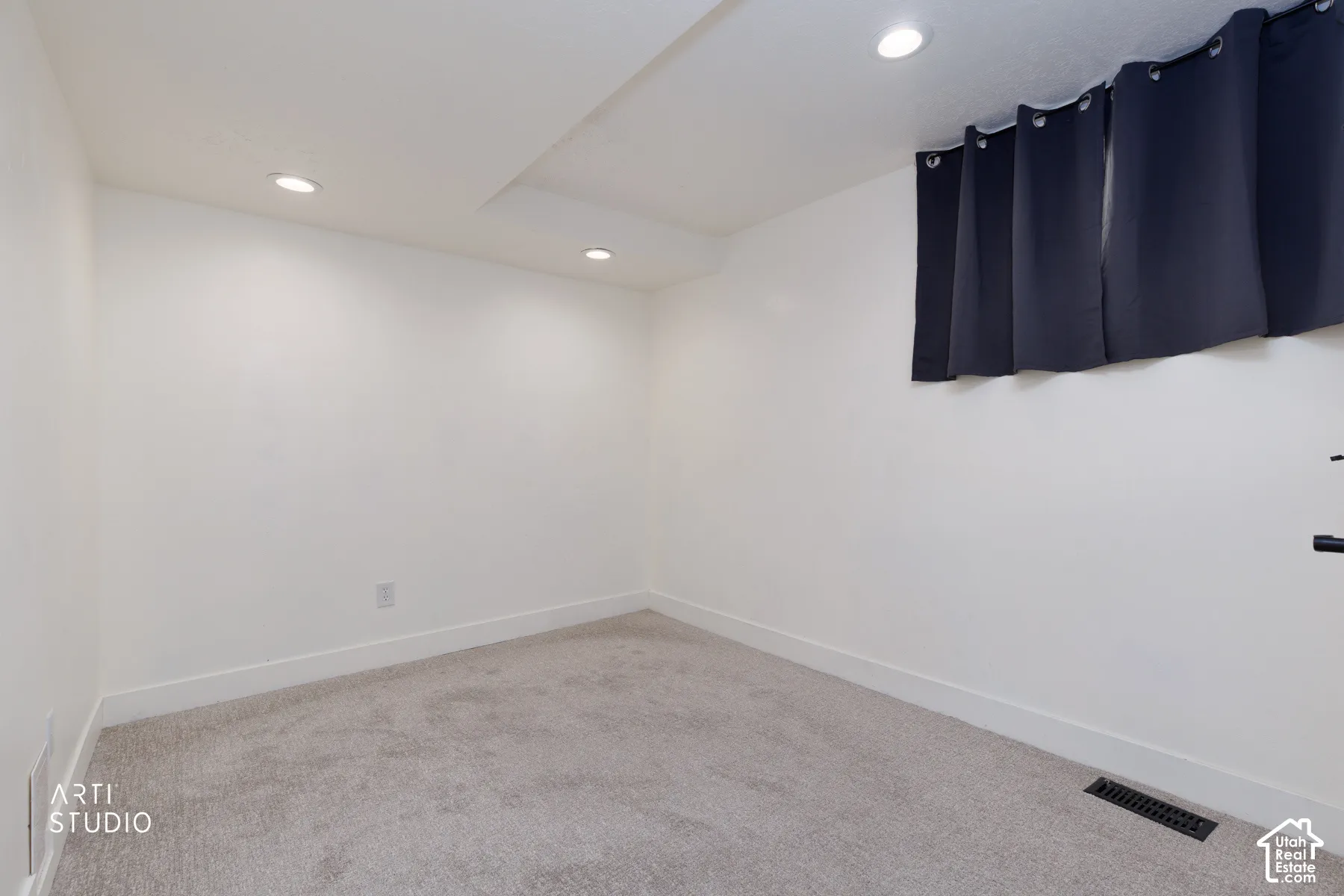 Neutral-toned carpeting paired with white walls