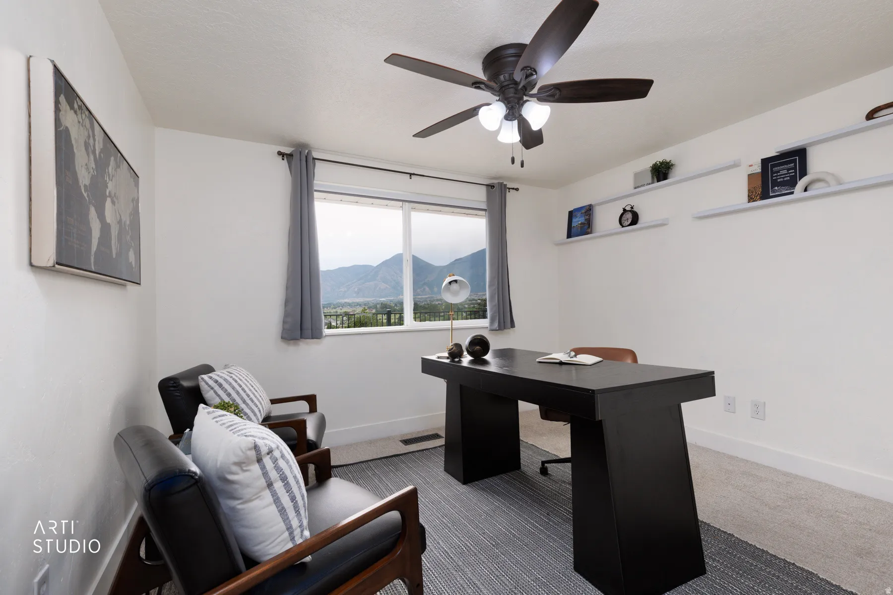 Room featuring a window with mountain scenery, a ceiling fan with integrated lighting, and white floating wall shelves