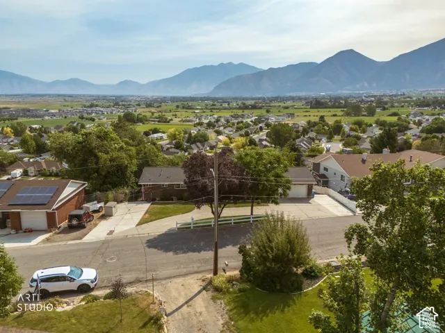Expansive mountainous scenery frames the surrounding neighborhood